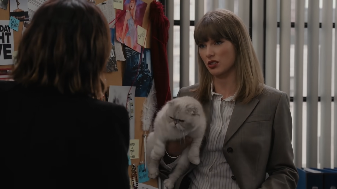 Taylor Swift com sua gata, Olivia Benson.
